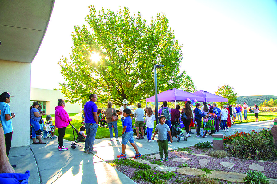 Crowd of people outside on campus