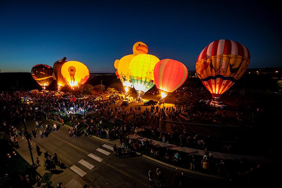 Balloons inflating in the Henderson Fine Arts Center parking lot at the 2022 Four Corners Balloon Rally.